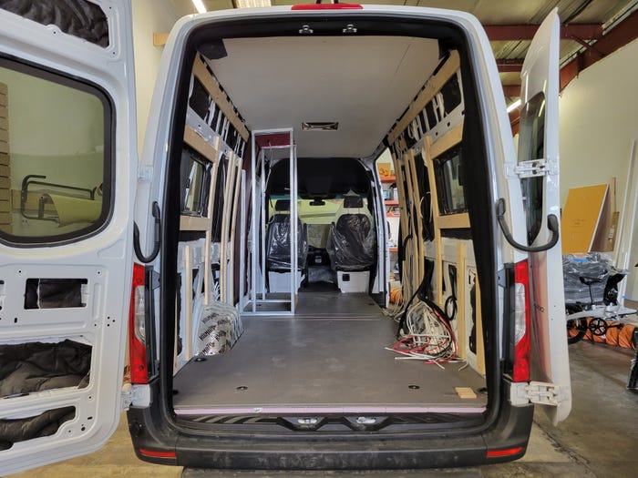 The original van during construction with the skeleton of the interior exposed.