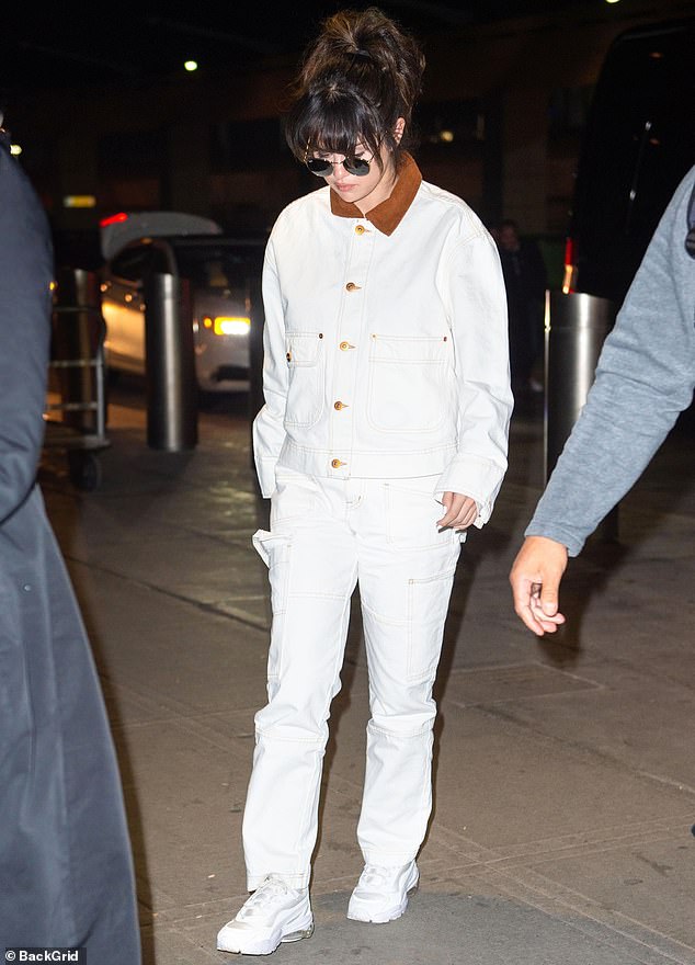 Her look: The Texas native wore a white, denim-on-denim ensemble. The Texas native's SLVRLAKE jacket featured a brown collar