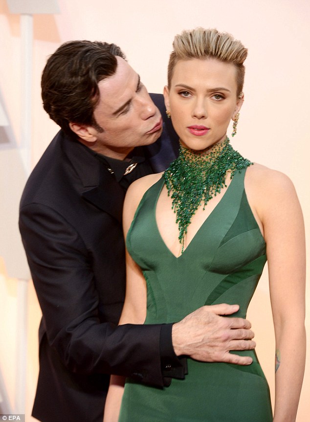 Nothing to see here: Scarlett Johansson has debunked the already infamous picture of her getting kissed by John Travolta at last Sunday's Oscars