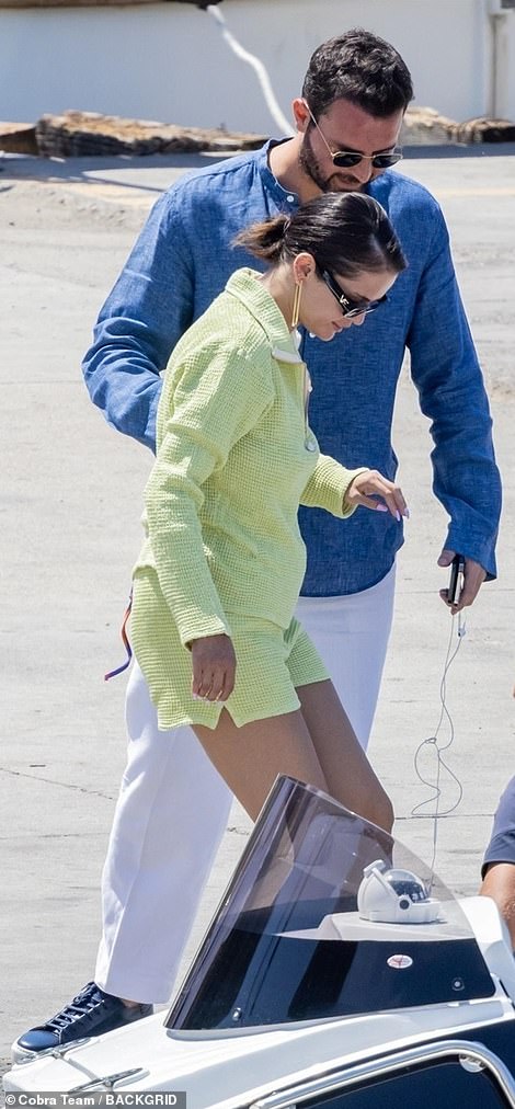 Adorable: The singer look happier than ever as the Italian–Canadian film producer helped her board the waiting vessel