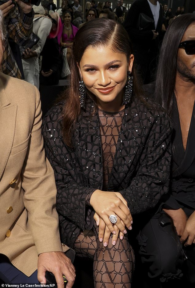 Beauty: Zendaya sported a bronzed makeup palette which accentuated her natural features, teamed with a swipe nude lipstick as she sat front row