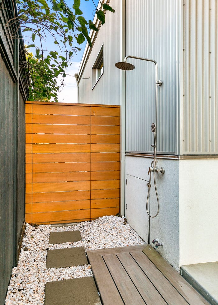 outdoor shower with a cedar gate and beige, dvele, malibu