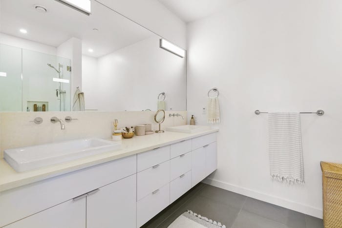 prefab home bathroom, white cabinets and sink, dvele, malibu